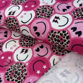 Sweaterstof Happy faces pink digital print